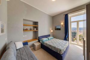 Katil atau katil-katil dalam bilik di B&B La Certosa di San Martino