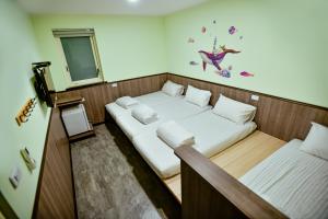 Letto o letti in una camera di Ye Yuan Star Homestay