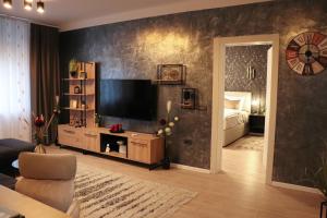 Televízia a/alebo spoločenská miestnosť v ubytovaní 'NAP' apartment