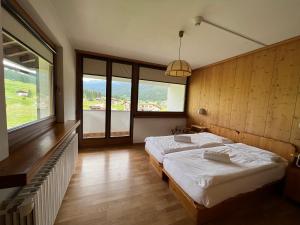 Postel nebo postele na pokoji v ubytování Hotel D'La Varda