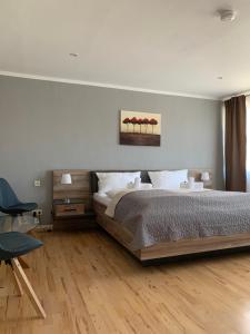 En eller flere senge i et værelse på HGH - Hotel Garni Helbig