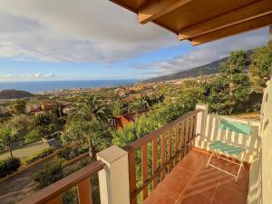 a balcony of a house with a view of the ocean at Casa Buena Vista in La Orotava