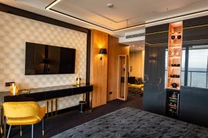 Televízia a/alebo spoločenská miestnosť v ubytovaní Golden Eye Apartament Seaside Park
