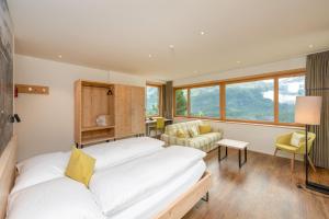 Postel nebo postele na pokoji v ubytování Berghotel Randolins