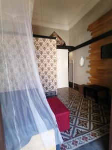 A bed or beds in a room at L'Antico Palazzo rooms
