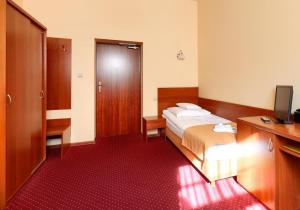 Ένα ή περισσότερα κρεβάτια σε δωμάτιο στο Soplicowo
