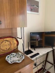 A television and/or entertainment centre at Lander Residence