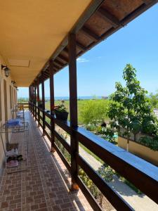 a porch with a view of the ocean at Casa de la Corbu in Corbu