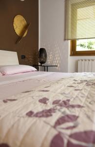 Postel nebo postele na pokoji v ubytování La Casa di Emy + 37 fotografií