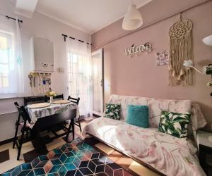 a living room with a couch and a table at Happy House in Năvodari
