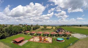 an aerial view of a home with a large yard at Domki Romka in Mikołajki