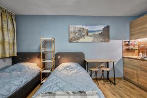 a small room with two beds and a kitchen at Top Center, Sea Garden, Brand New Studio - Majestic in Burgas City