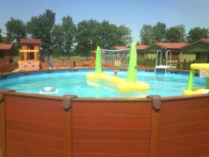 a large swimming pool with at Domki Romka in Mikołajki