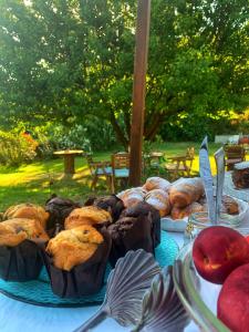 a table topped with different types of pastries and pies at Affittacamere La Petra Longa in San Teodoro