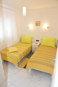 Postel nebo postele na pokoji v ubytování ONDINA apartments