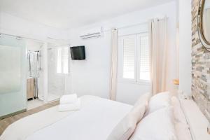 Postel nebo postele na pokoji v ubytování Marmoles 21, City Center Apartment