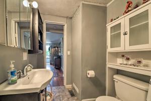 a bathroom with a sink and a toilet at Cheerful Grand Rivers Cottage, half Mi to Lake in Grand Rivers +23 photos