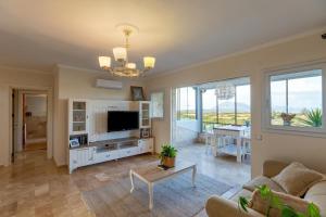 a living room with a couch and a table at Casa Di Datca in Datca