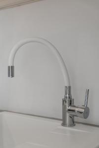 a kitchen sink with a chrome kitchen faucet at Salvatore's Island House in Mýkonos City