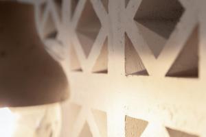 a close up of a white wall with a design on it at Salvatore's Island House in Mikonos