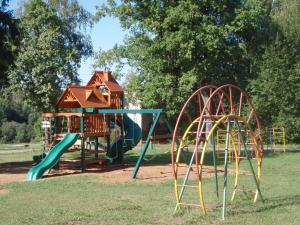 a playground with two slides and a play structure at Pansionat Voskhod in Sergiyev Posad