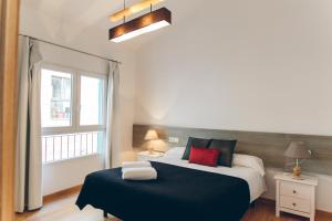 Tempat tidur dalam kamar di The Lucky Flats - Artilleros