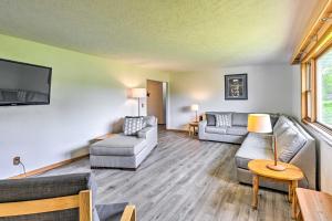 a living room with two couches and a tv at Stunning Wisconsin Retreat on Active Farm! in Spring Green