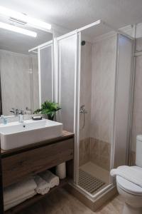 a bathroom with a sink and a shower at Remvi in Komotini