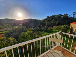 a view from the balcony of a house at Raio do Sol - Apartamento Turístico in Muxia