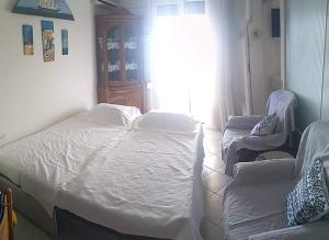 מיטה או מיטות בחדר ב-Bay view apartment