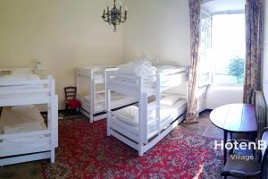 Posteľ alebo postele v izbe v ubytovaní Le château du Fraysseix à Roziers-Saint-Georges