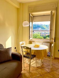 a dining room with a table and a window at La Divina in Cosenza