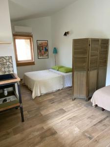 Postel nebo postele na pokoji v ubytování Les Chêneslierres