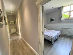 A bed or beds in a room at Casa de Los Carpinteros
