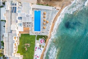 an aerial view of a resort on the beach at Selina Paros in Pounda