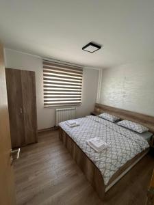 Postel nebo postele na pokoji v ubytování Zanes Apartment