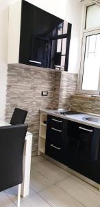 a kitchen with a sink and a counter top at Studios Centar in Split