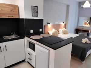 A kitchen or kitchenette at Valentinos Apartments