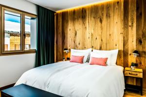 Postel nebo postele na pokoji v ubytování Boutique Hotel Pellas