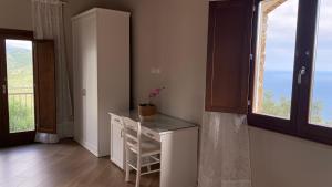a room with a white desk and a window at Tenuta Belvedere Cilento in Montecorice +48 photos