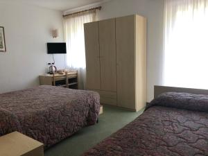 Voodi või voodid majutusasutuse Garnì Mariolina toas