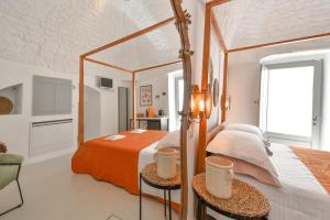 Ένα ή περισσότερα κρεβάτια σε δωμάτιο στο Corte Giotto Exclusive House