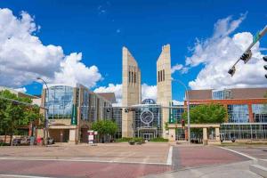 a large building with two towers on a city street at Spacious 2bedroom FREE parking king bed close to DT in Edmonton