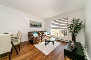 a living room with a couch and a window at Spacious 2bedroom FREE parking king bed close to DT in Edmonton