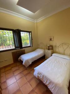 Postel nebo postele na pokoji v ubytování Villa Las Viñas