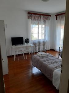 Postel nebo postele na pokoji v ubytování EasyRoom Piovene Rocchette