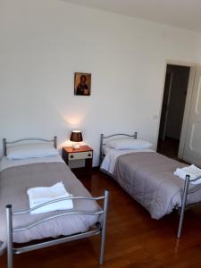 Postel nebo postele na pokoji v ubytování EasyRoom Piovene Rocchette