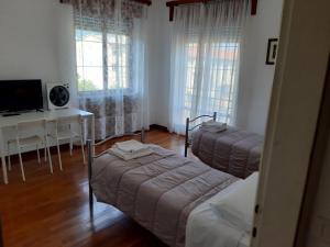 Postel nebo postele na pokoji v ubytování EasyRoom Piovene Rocchette