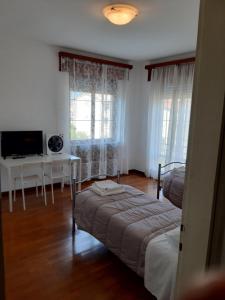 Postel nebo postele na pokoji v ubytování EasyRoom Piovene Rocchette