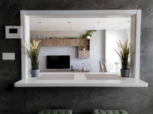 a living room with a fireplace and a tv at Las Palmas Golf & Beach in Las Palmas de Gran Canaria